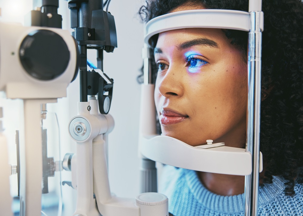 A woman undergoing an eye examination with a slit lamp at an optometrist's office - Optometrist Chapel Hill A woman undergoing an eye examination with a slit lamp at an optometrist's office - Optometrist Chapel Hill